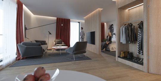 To personer på et to-værelset hotelværelse med sofagruppe og fjernsyn